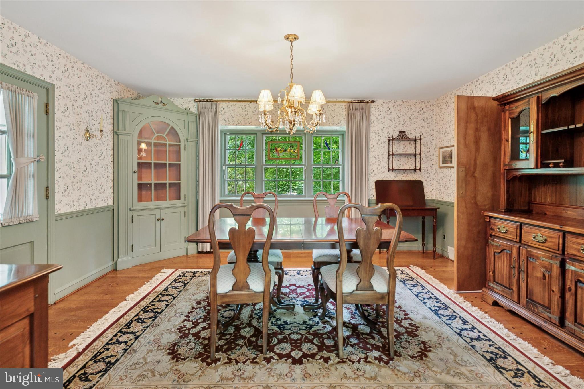 240 Rices Mill Road Wyncote, PA 19095 - Photo 5 of 36 a living room with fireplace furniture and a chandelier