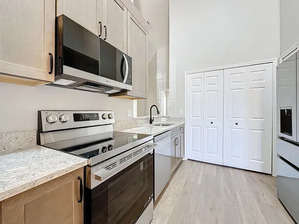 a bathroom with a sink and mirror with toilet