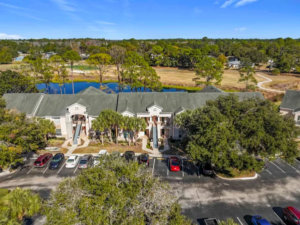 a living room with furniture and flowers