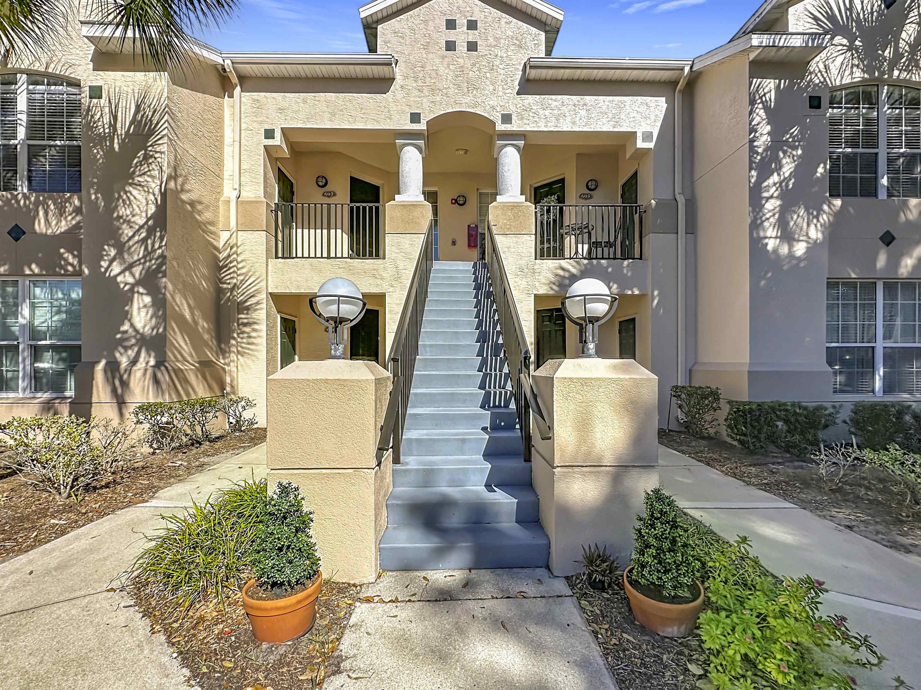 607 Augusta Circle, Unit 607 St. Augustine, FL 32086 - Photo 6 of 40 View of building exterior featuring stairway