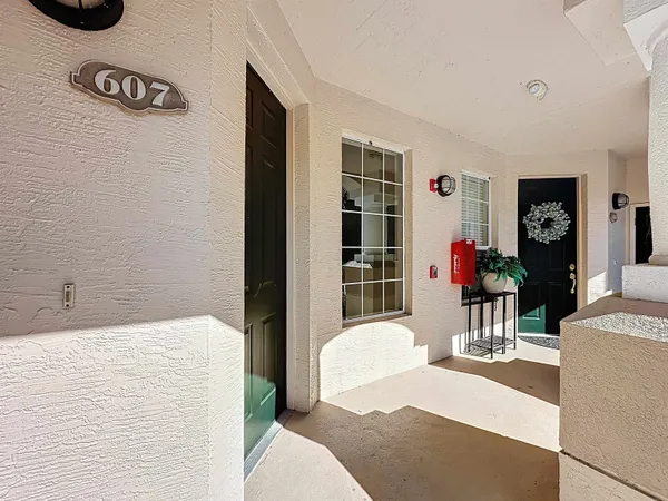 a utility room with wooden floor washer and dryer