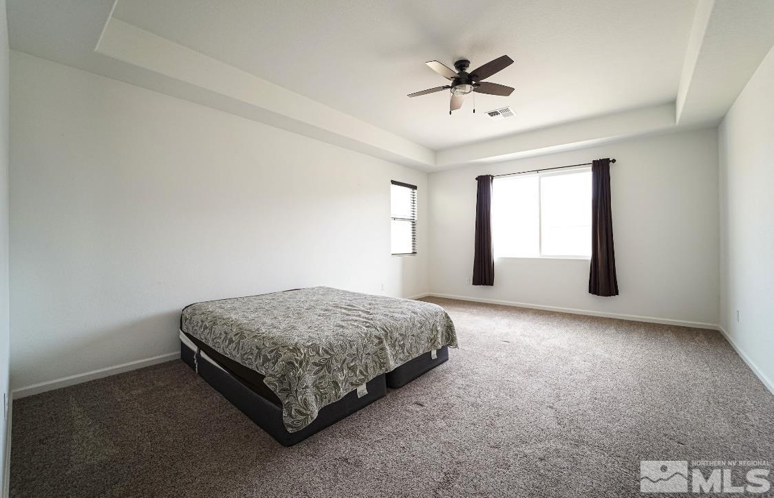10080 Ellis Park Lane Reno, NV 89521 - Photo 13 of 26 a spacious bedroom with a bed and window