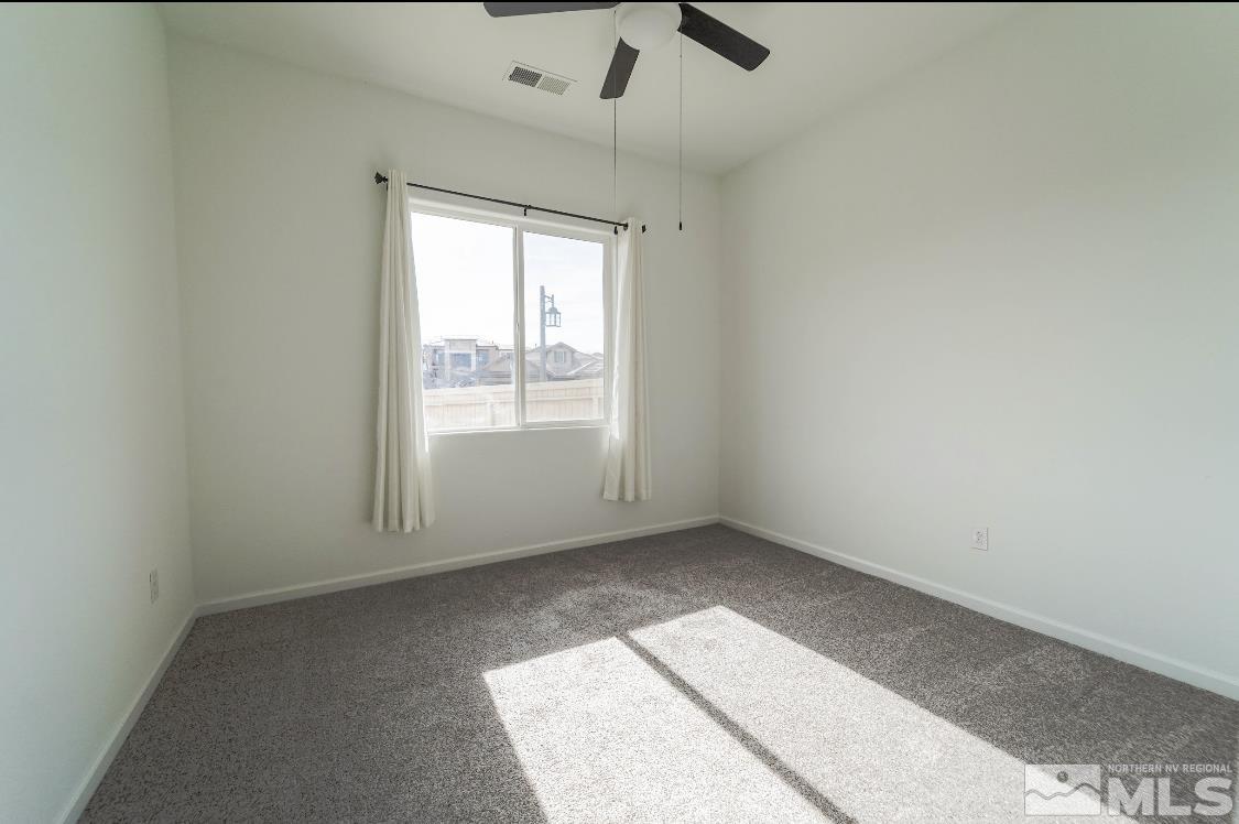 10080 Ellis Park Lane Reno, NV 89521 - Photo 14 of 26 an empty room with a window
