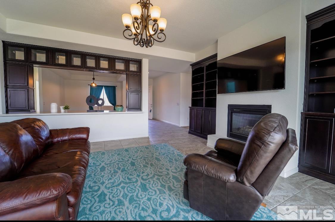 10080 Ellis Park Lane Reno, NV 89521 - Photo 8 of 26 a living room with furniture and a flat screen tv