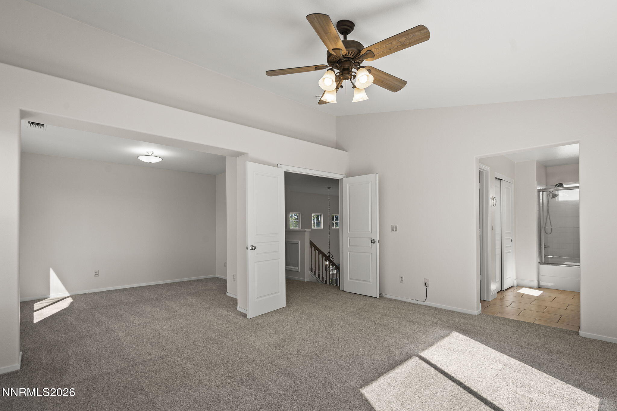 5490 Twin Creeks Drive Reno, NV 89523 - Photo 15 of 27 a view of a livingroom with a ceiling fan
