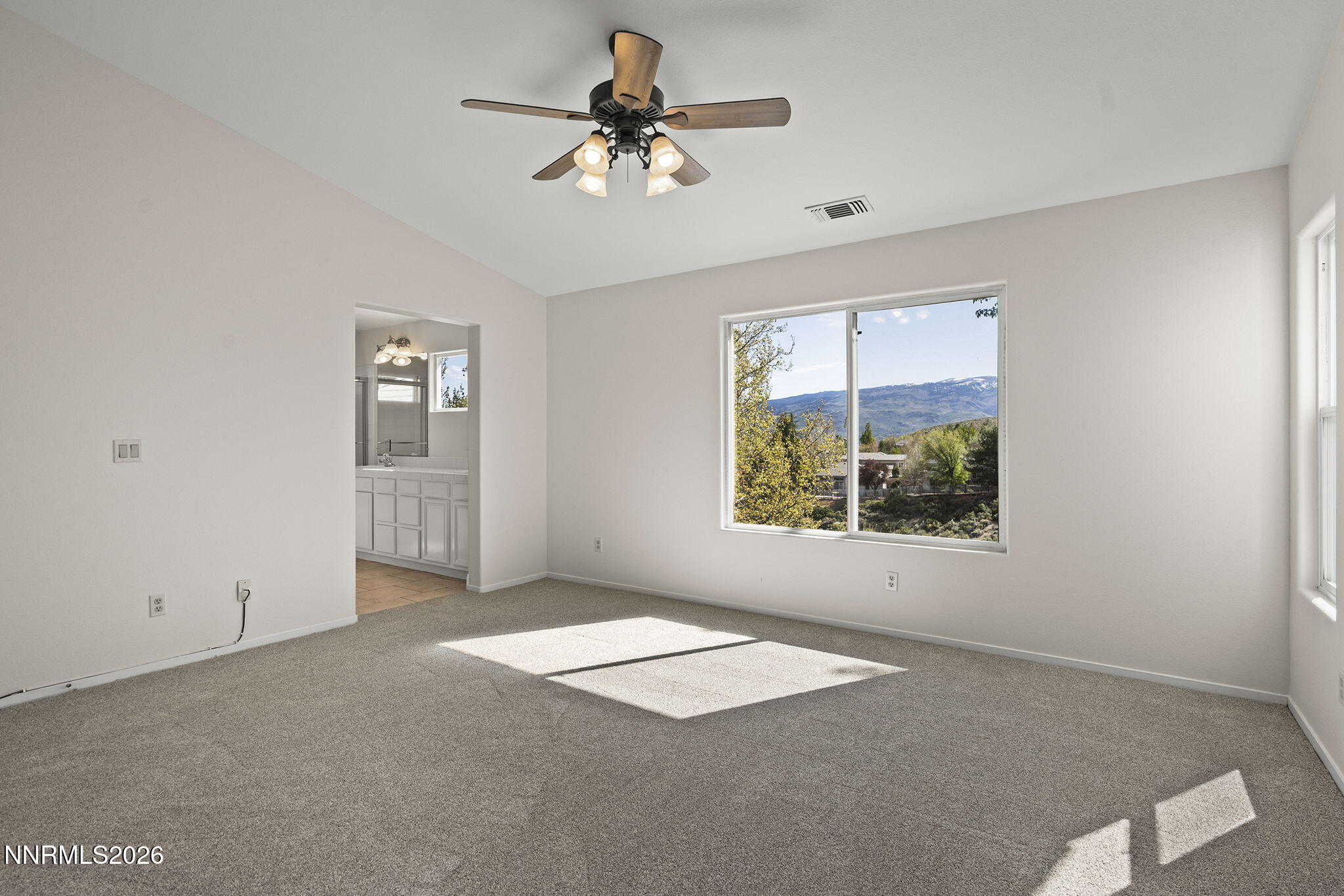 5490 Twin Creeks Drive Reno, NV 89523 - Photo 16 of 27 an empty room with windows and ceiling fan
