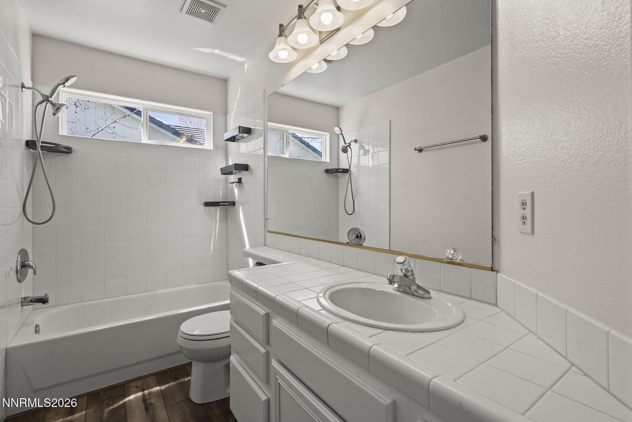 5490 Twin Creeks Drive Reno, NV 89523 - Photo 18 of 27 a bathroom with a sink granite tub toilet and shower