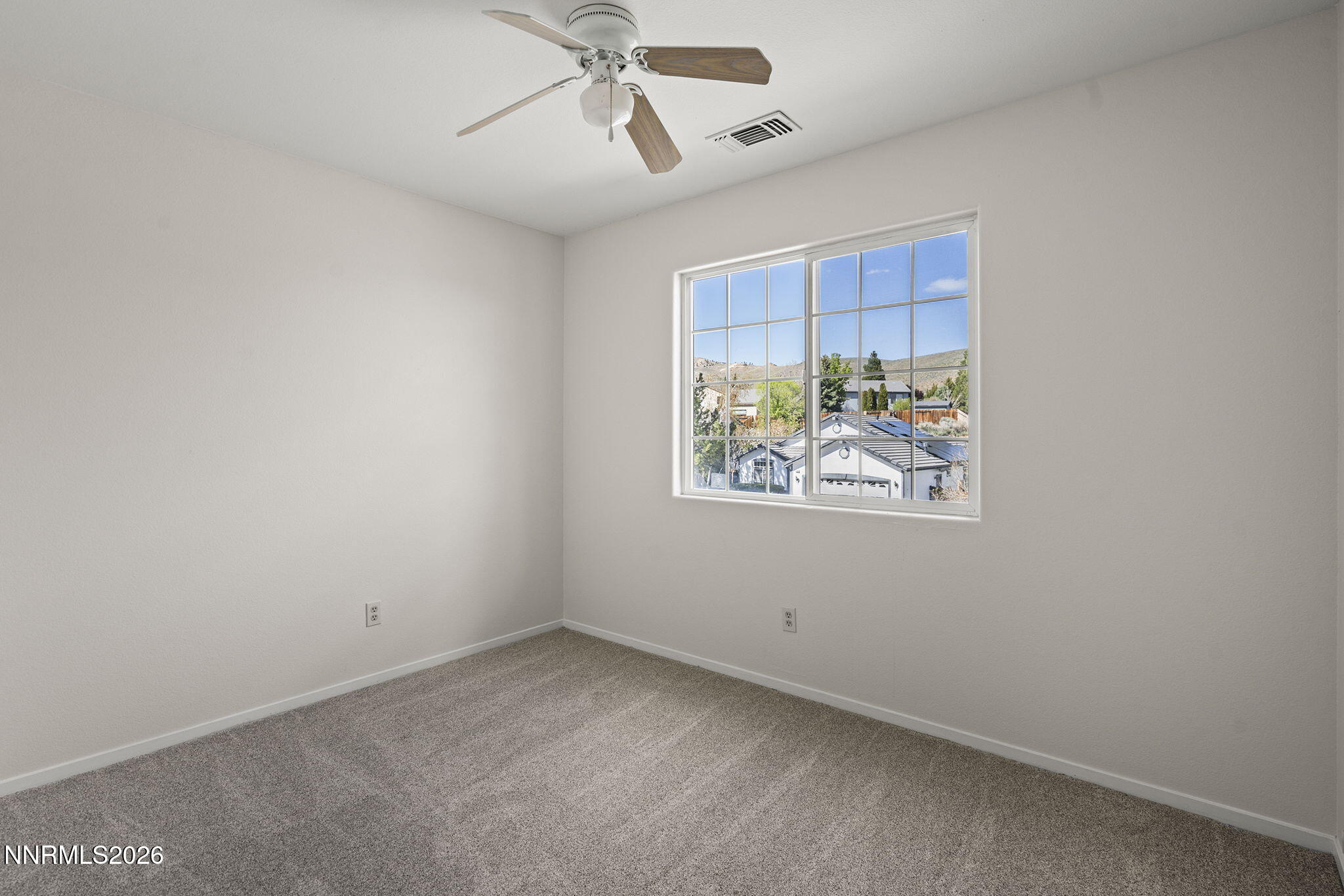 5490 Twin Creeks Drive Reno, NV 89523 - Photo 20 of 27 en empty room with window and ceiling fan