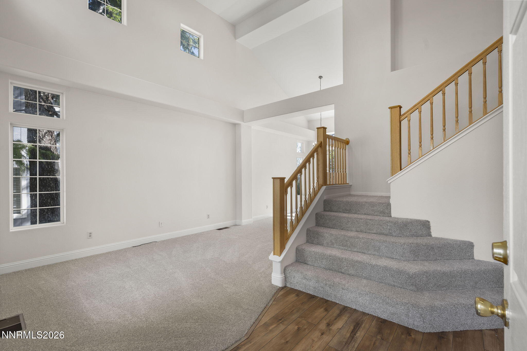 5490 Twin Creeks Drive Reno, NV 89523 - Photo 2 of 27 a view of staircase with white walls and windows