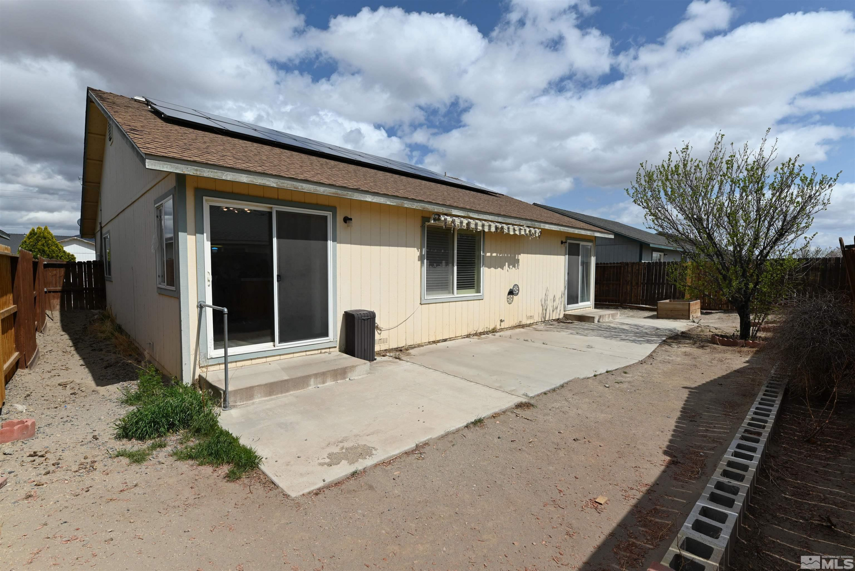 2129 Fort Bridger Road Fernley, NV 89408 - Photo 12 of 21 a front view of a house with garden