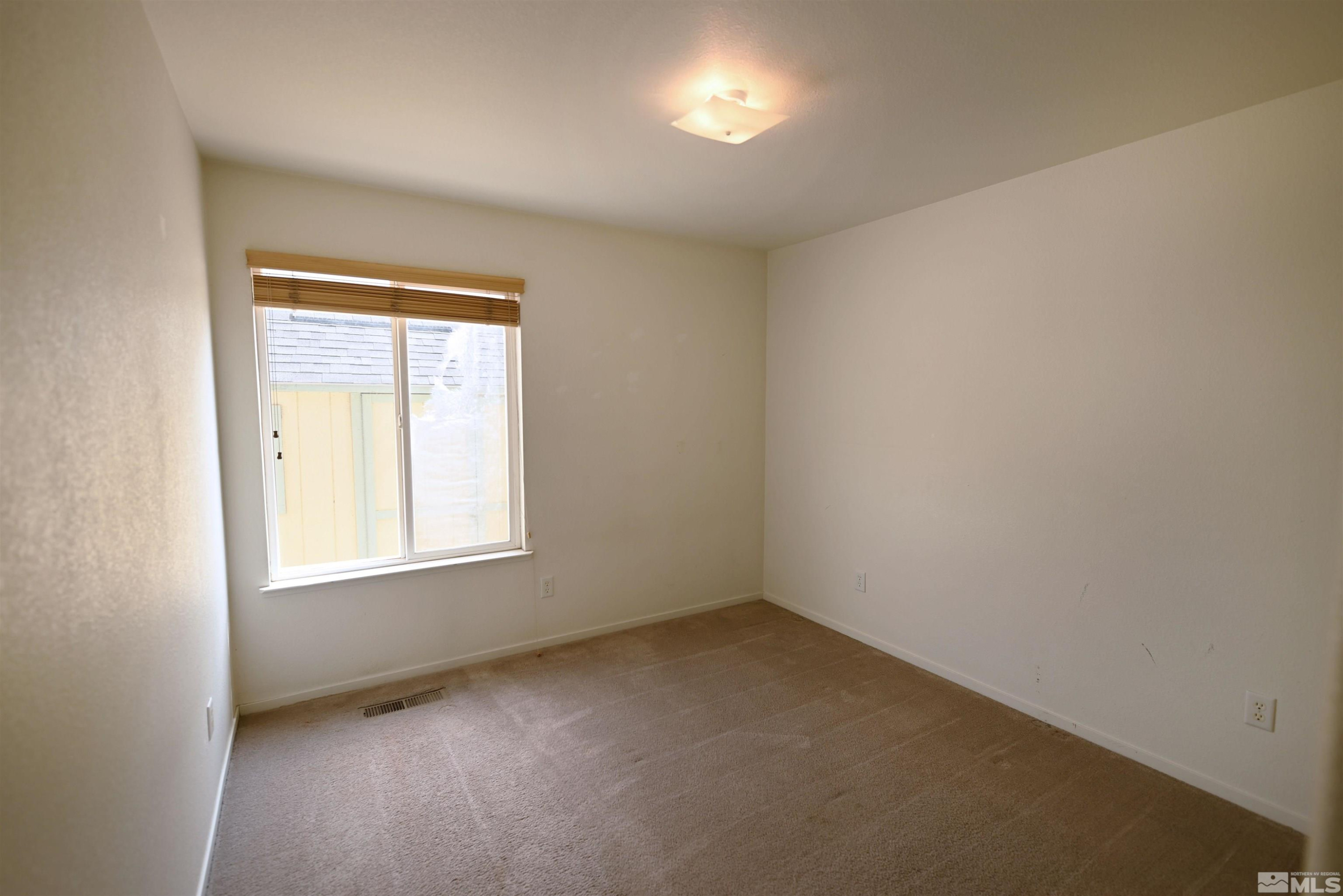 2129 Fort Bridger Road Fernley, NV 89408 - Photo 16 of 21 an empty room with a window