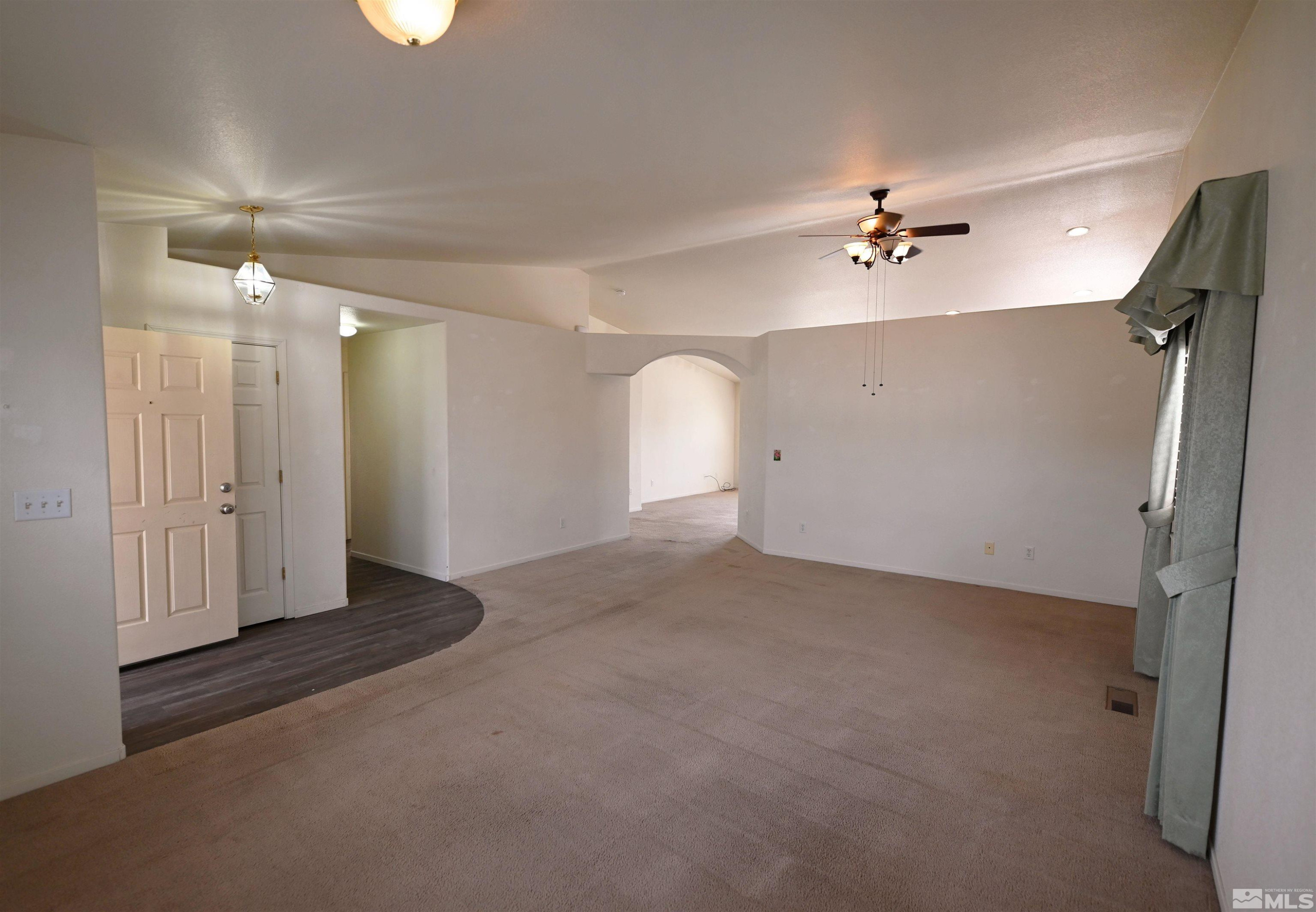 2129 Fort Bridger Road Fernley, NV 89408 - Photo 3 of 21 wooden floor in an empty room