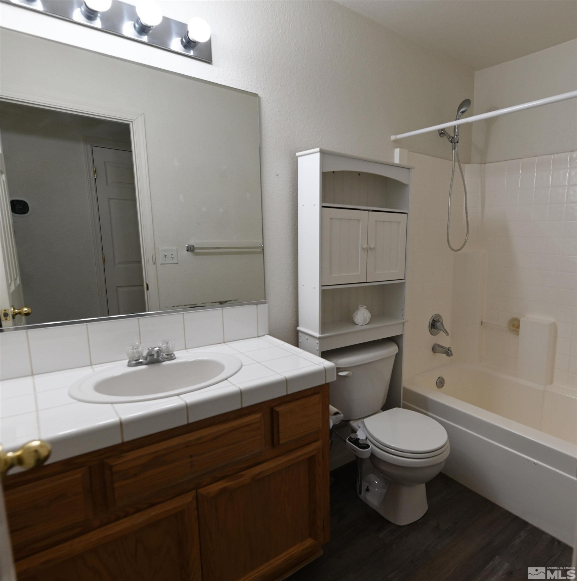2129 Fort Bridger Road Fernley, NV 89408 - Photo 8 of 21 a bathroom with a sink toilet and shower