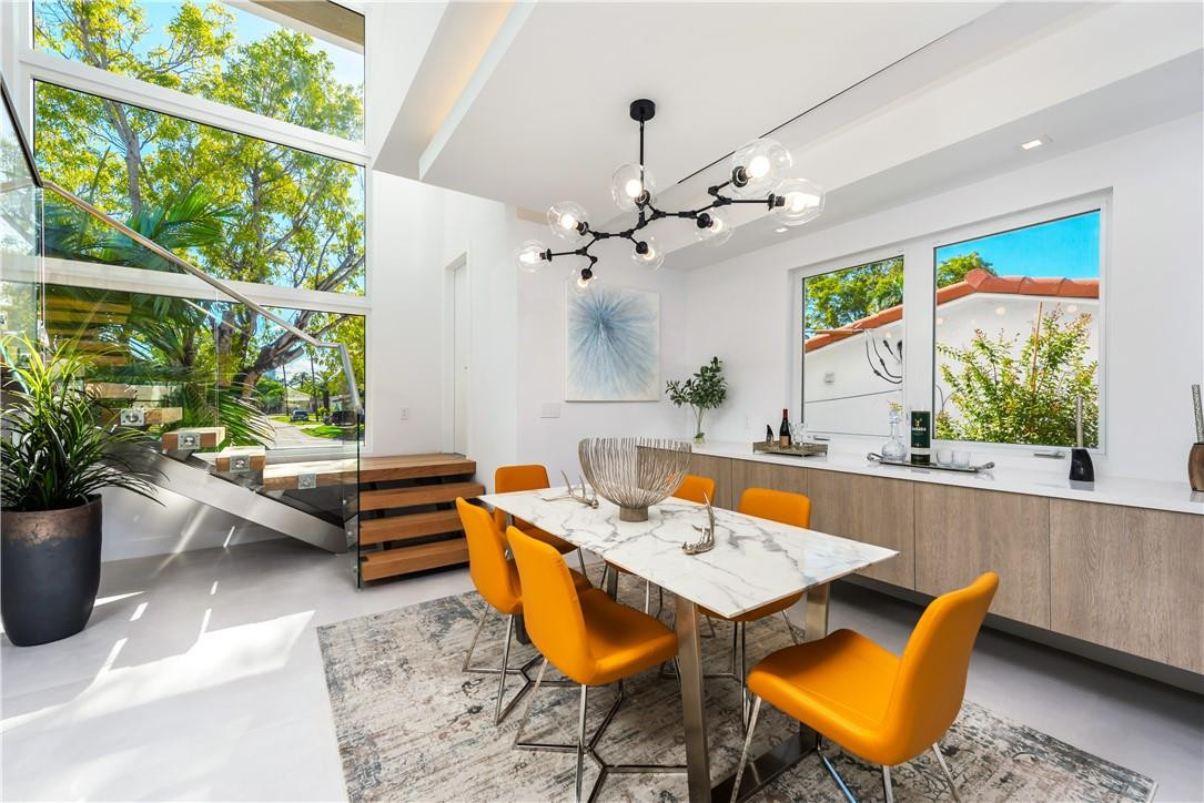 4610 Alton Road Miami Beach, FL 33140 - Photo 14 of 60 a outdoor dining space with furniture and garden view