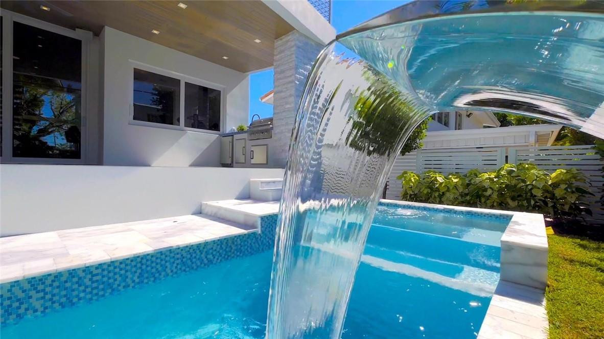4610 Alton Road Miami Beach, FL 33140 - Photo 18 of 60 a view of entryway and hall with wooden floor