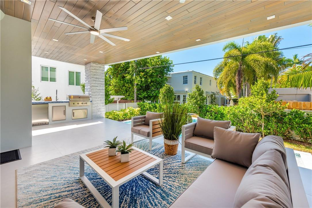 4610 Alton Road Miami Beach, FL 33140 - Photo 20 of 60 a living room with furniture and a large window