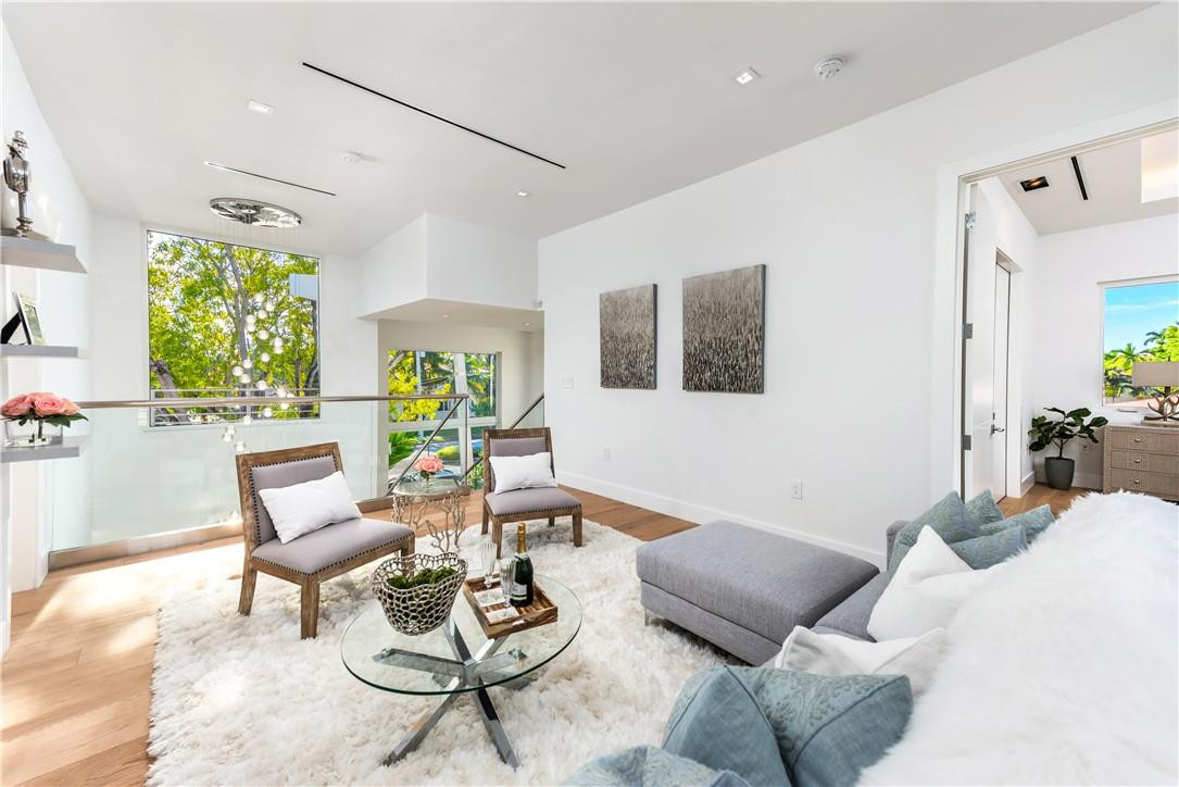 4610 Alton Road Miami Beach, FL 33140 - Photo 25 of 60 a living room with furniture and a large window