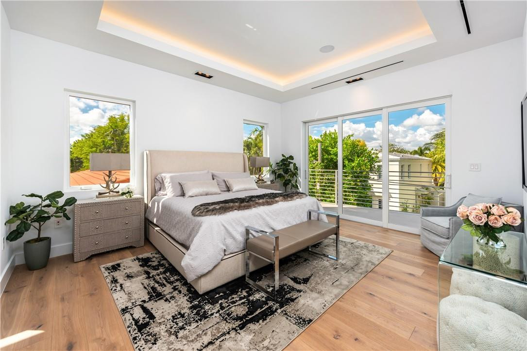 4610 Alton Road Miami Beach, FL 33140 - Photo 26 of 60 a bed room with a bed and a couch