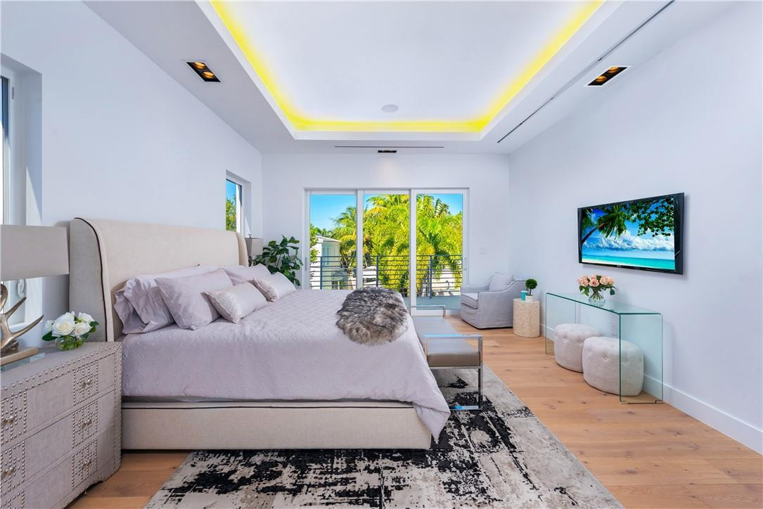 4610 Alton Road Miami Beach, FL 33140 - Photo 27 of 60 a bedroom with a bed couch and window