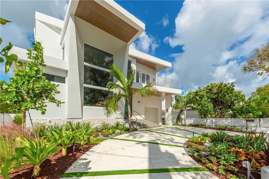 4610 Alton Road Miami Beach, FL 33140 - Photo 37 of 60 a front view of a house with garden