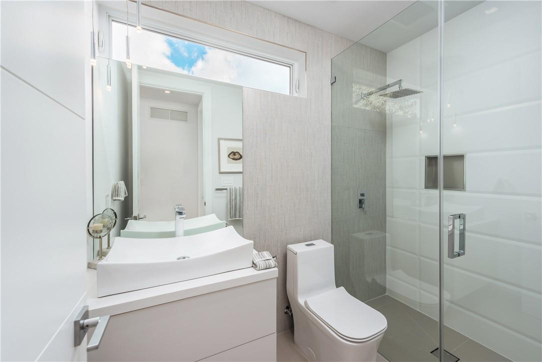 4610 Alton Road Miami Beach, FL 33140 - Photo 47 of 60 a bathroom with a sink toilet and shower