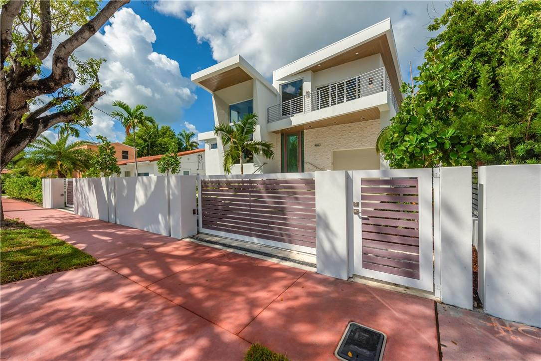 4610 Alton Road Miami Beach, FL 33140 - Photo 49 of 60 a front view of a house with a garage