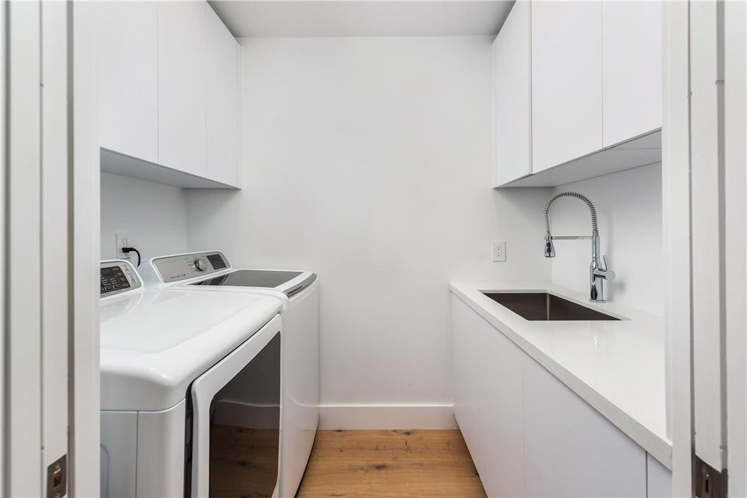 4610 Alton Road Miami Beach, FL 33140 - Photo 57 of 60 a utility room with dryer and washer