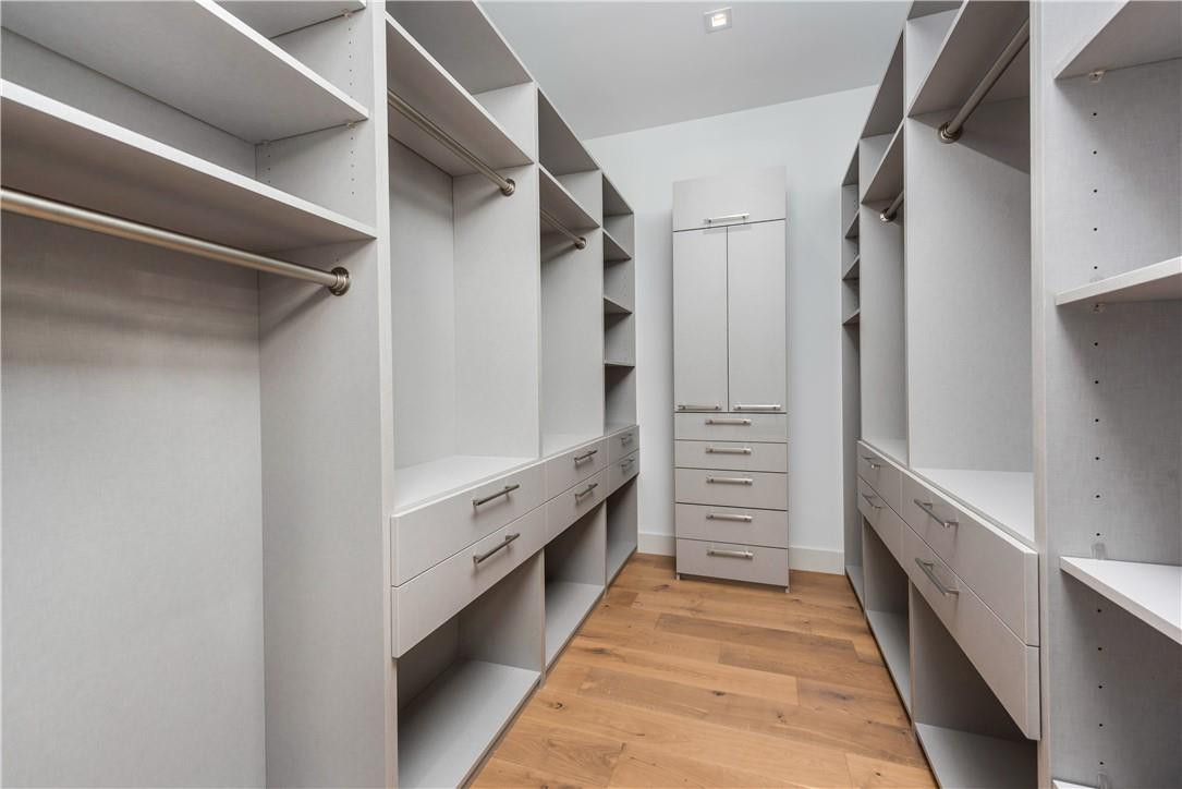 4610 Alton Road Miami Beach, FL 33140 - Photo 58 of 60 a bathroom with a double vanity sink and a large mirror