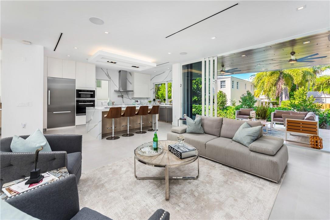 4610 Alton Road Miami Beach, FL 33140 - Photo 6 of 60 a living room with furniture and a large window