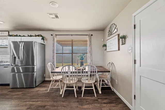 a view of a dining room with furniture window and outside view