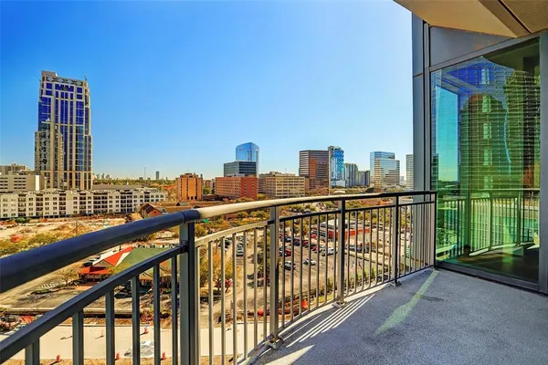 a living room with stainless steel appliances kitchen island granite countertop furniture and a view of kitchen