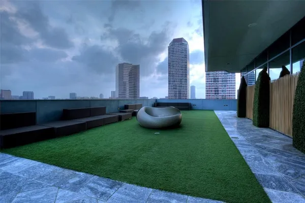 a view of a room with wooden floor and city view