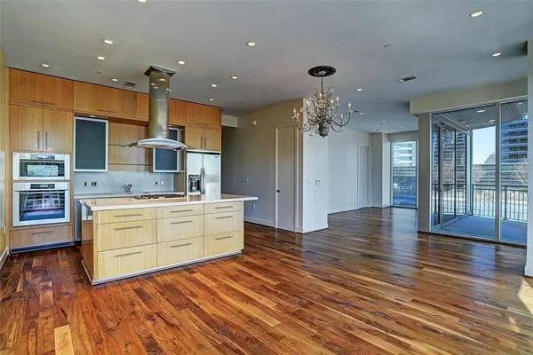 a bathroom with a tub a sink and glass door shower