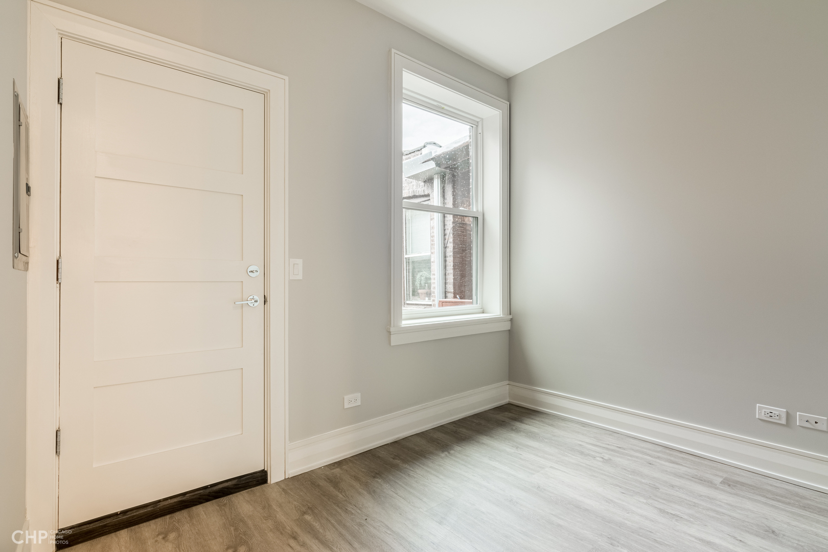 2318 West Thomas Street, Unit 3R Chicago, IL 60622 - Photo 7 of 12 an empty room with windows and closet