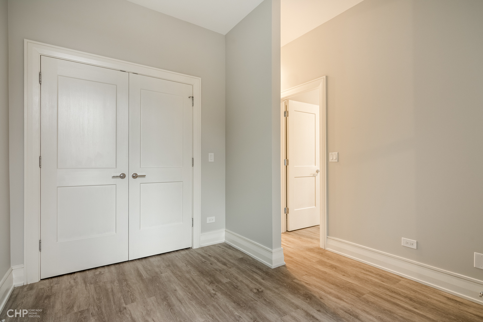 2318 West Thomas Street, Unit 3R Chicago, IL 60622 - Photo 8 of 12 a view of an empty room with wooden floor