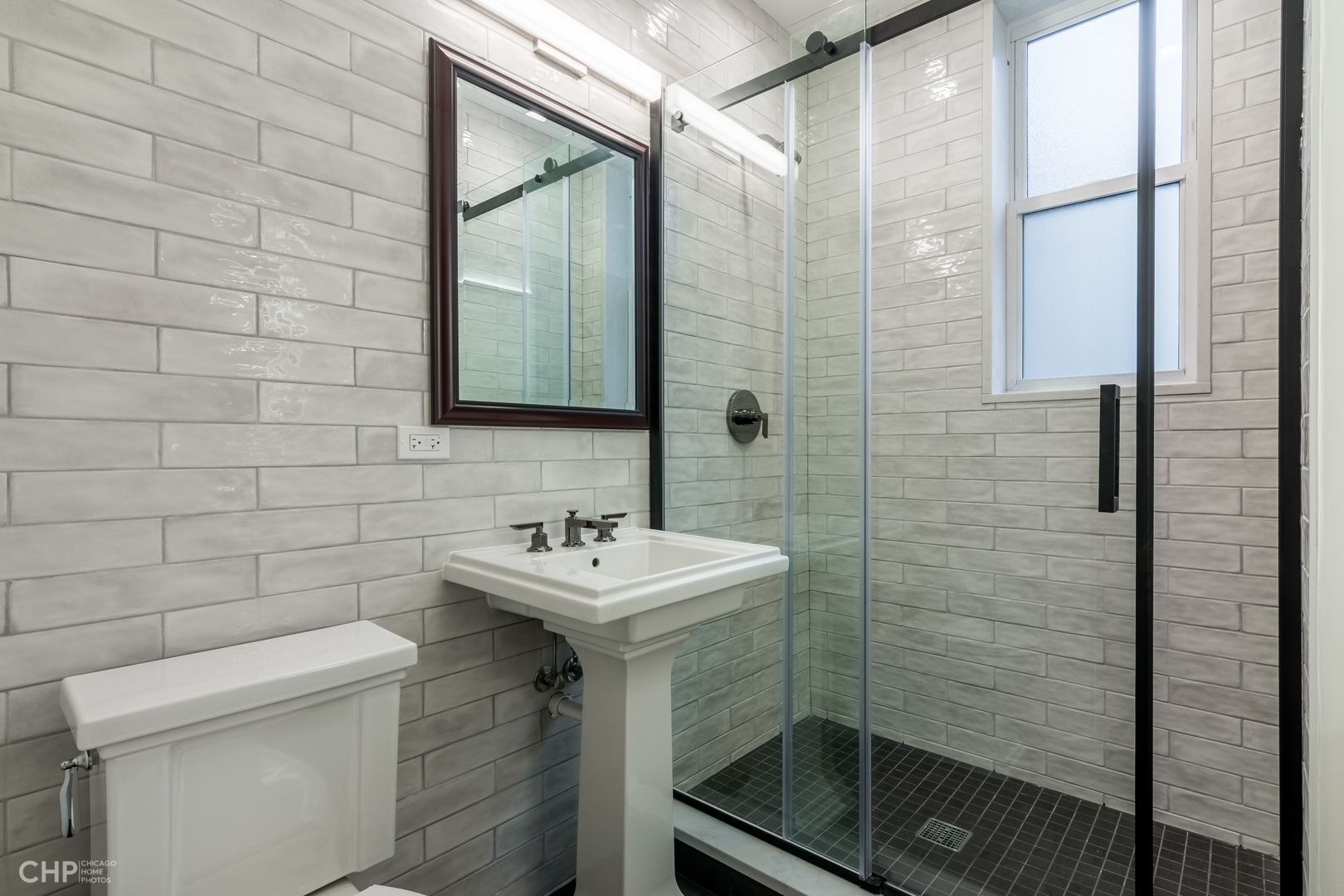 2318 West Thomas Street, Unit 3R Chicago, IL 60622 - Photo 9 of 12 a bathroom with a sink a toilet and shower