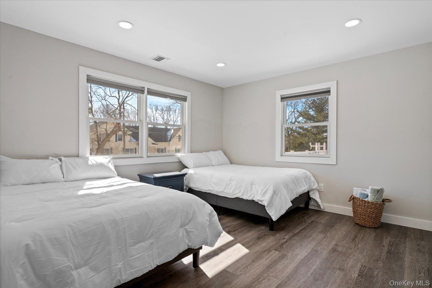 1150 Ruth Road Mattituck, NY 11952 - Photo 12 of 19 a bedroom with two beds and a large window