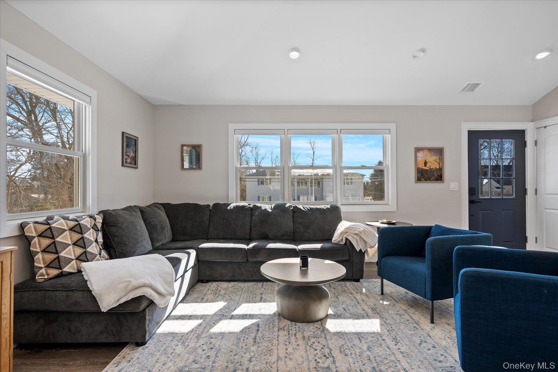 1150 Ruth Road Mattituck, NY 11952 - Photo 4 of 19 a living room with furniture and a large window