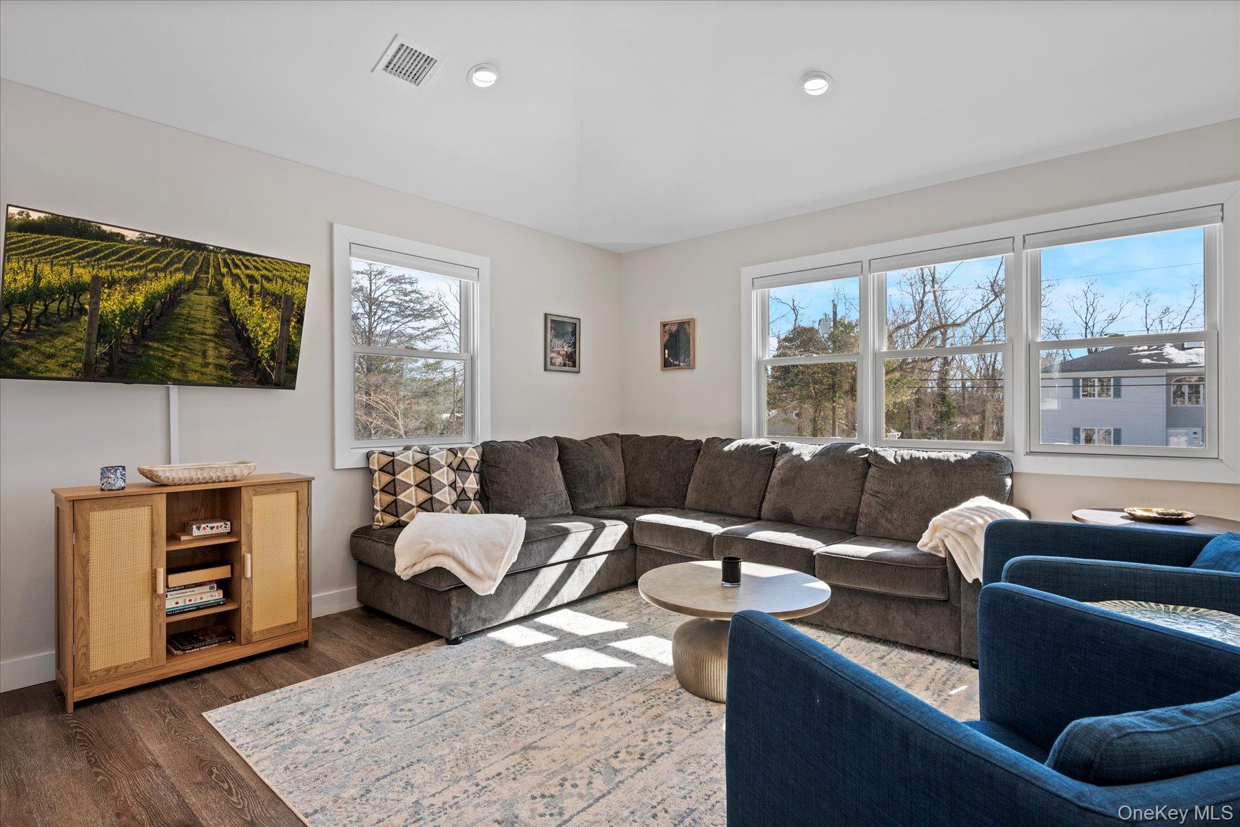 1150 Ruth Road Mattituck, NY 11952 - Photo 5 of 19 a living room with furniture and a flat screen tv