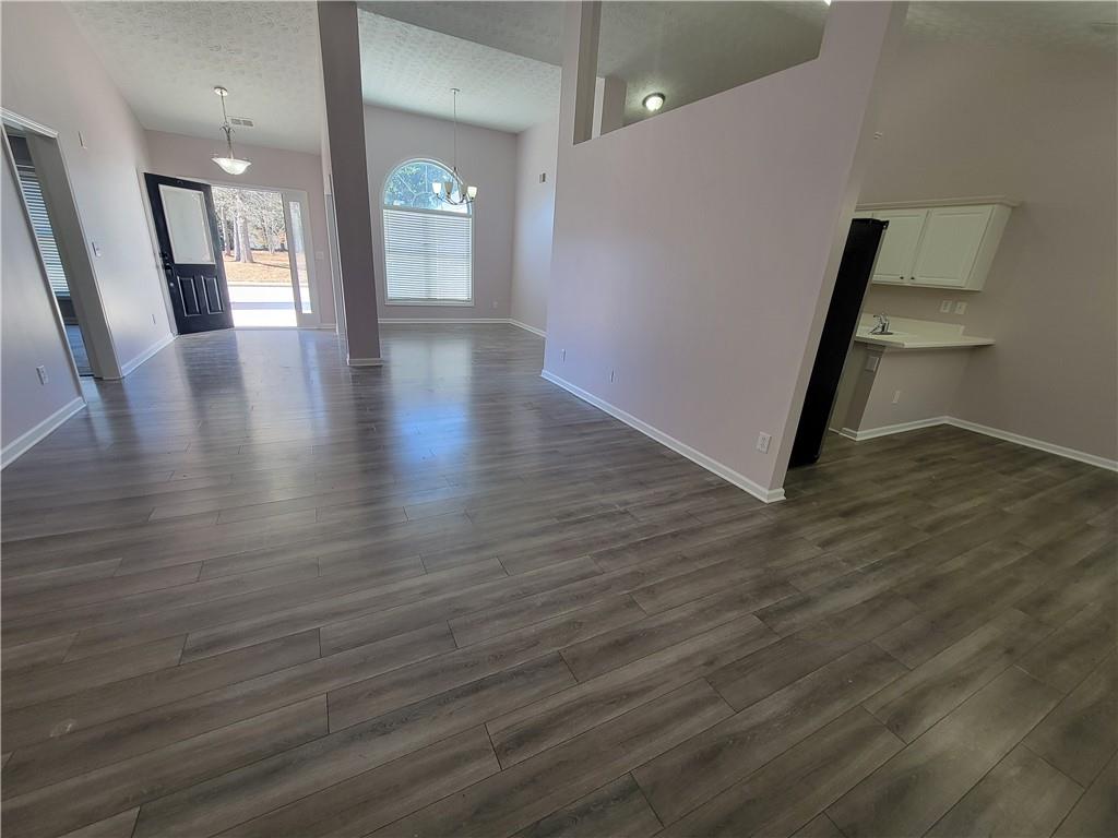 2213 Carlton Chase Road Dacula, GA 30019 - Photo 8 of 30 a view of an entryway with wooden floor