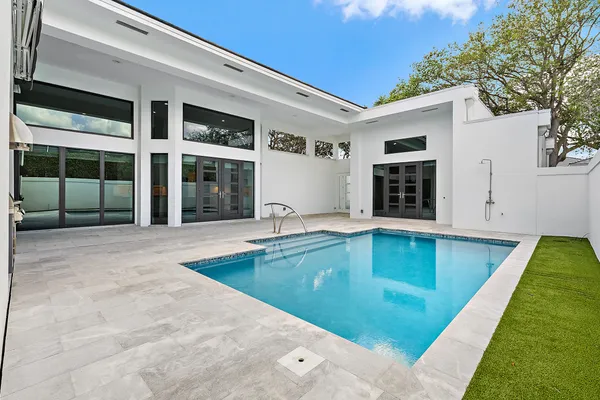 a view of a house with swimming pool