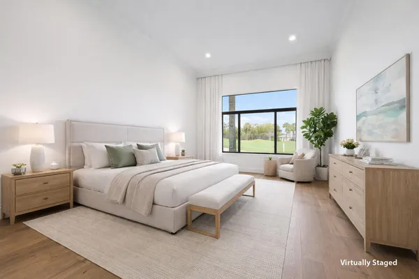 a spacious bedroom with a large bed and a couch