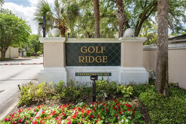 a sign broad in front of flowers
