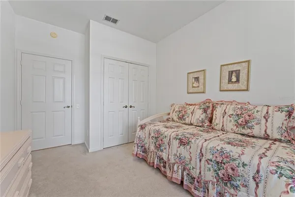 a bed room with a bed and a couch