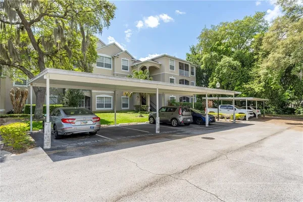a view of swimming pool with sitting area and garden