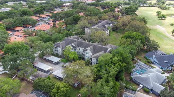 an aerial view of house with yard swimming pool and outdoor seating