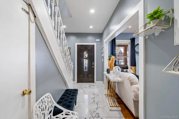 a dinning room with wooden floor and stairs