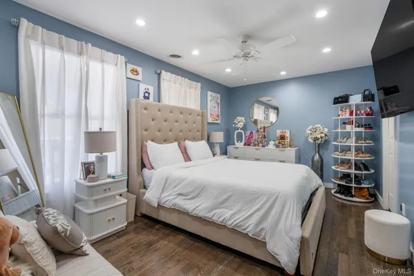 a bedroom with a large bed and a large window