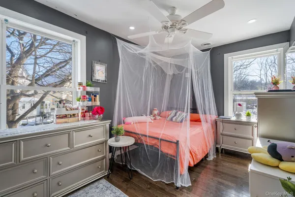 a bed room with a bed and a window