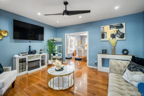 a living room with furniture and a flat screen tv